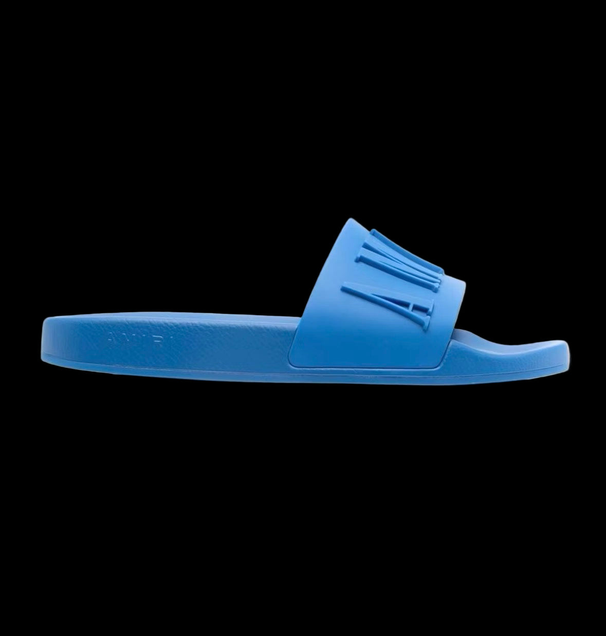 Black Amiri pool slides with wide straps and textured footbed for casual wear