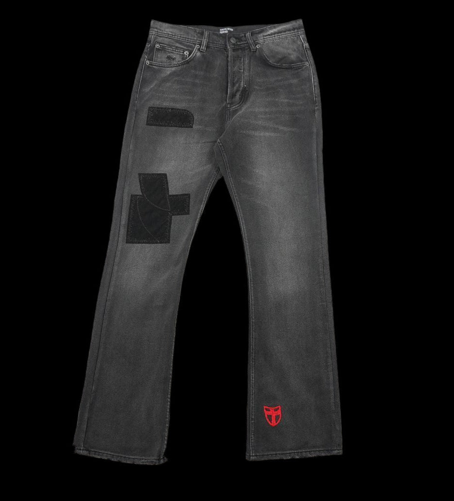 Enfant Riches Déprimés flared denims with patchwork details and red logo.