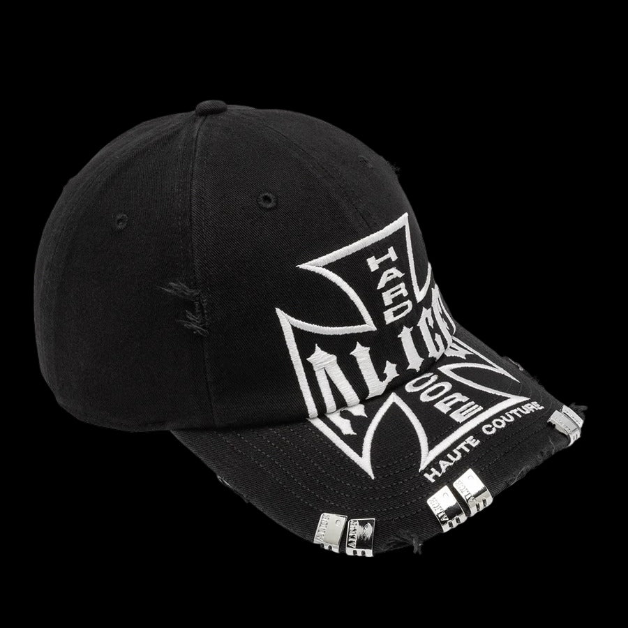 Black Alice Hollywood cap with distressed details and white cross graphic.