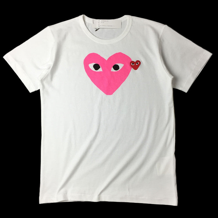 White Comme Des Garcons Play T-Shirt with a ribbed crewneck and short sleeves.