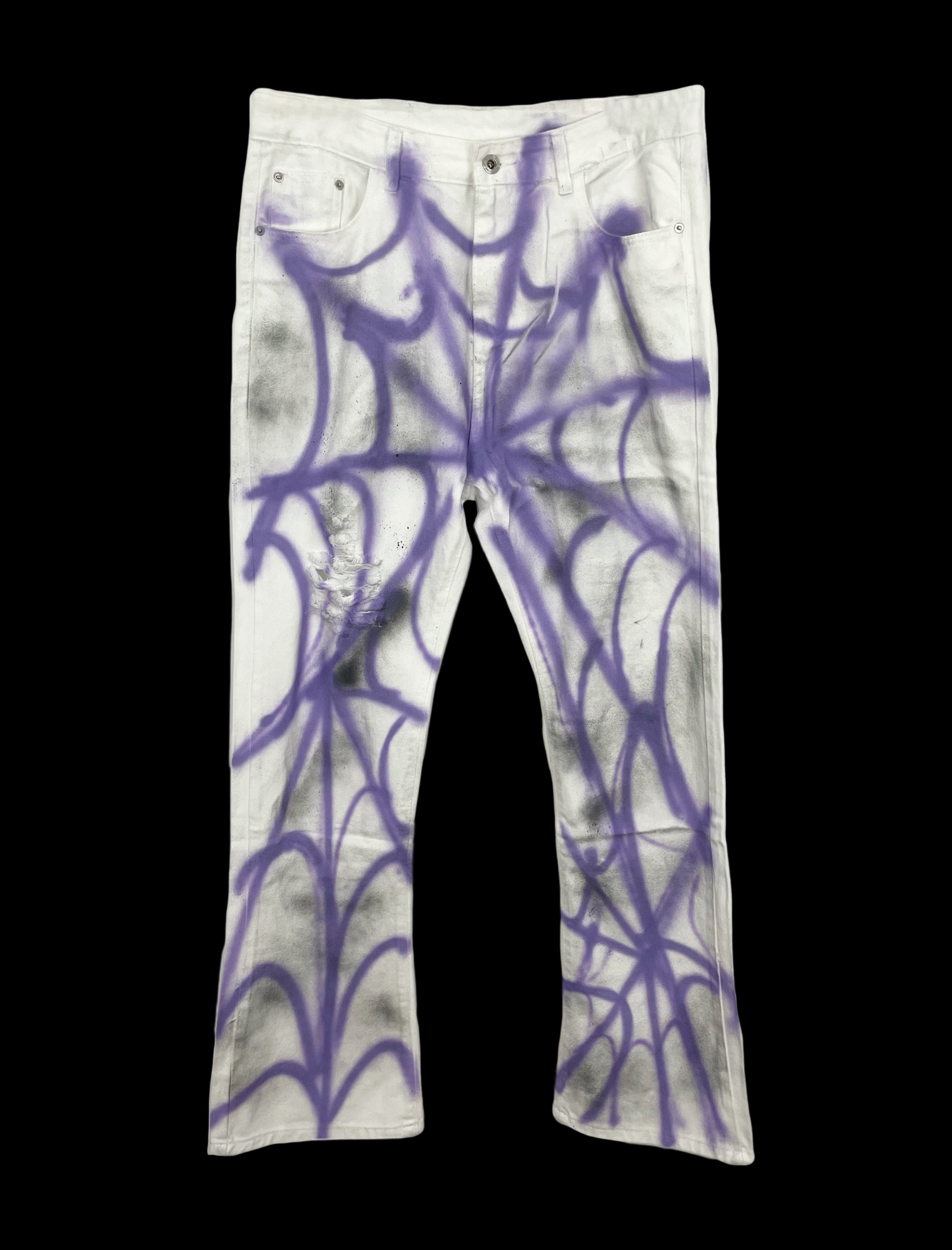 Purple faded wash jeans with spider print and classic five-pocket design