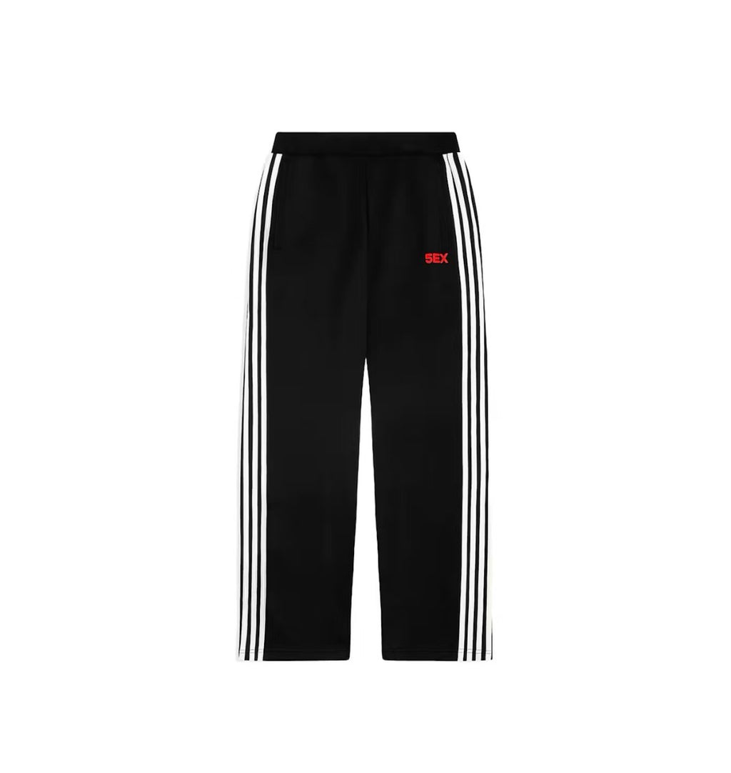 Black trackpants with a vintage faded wash and ribbed detailing.