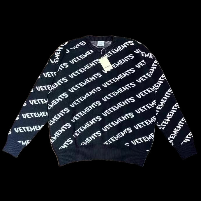 A black Vetements sweater made of heavyweight cotton with a relaxed fit and crew neckline.