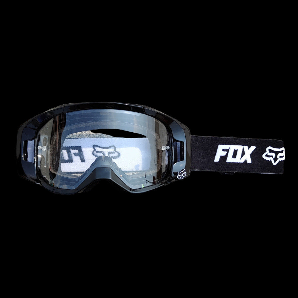 Fox Racing goggles with lightweight frame, anti-fog lens, and adjustable strap for secure fit.