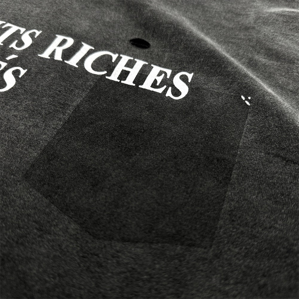 Black cotton t-shirt with vintage wash and logo, featuring a ribbed crewneck and short sleeves.