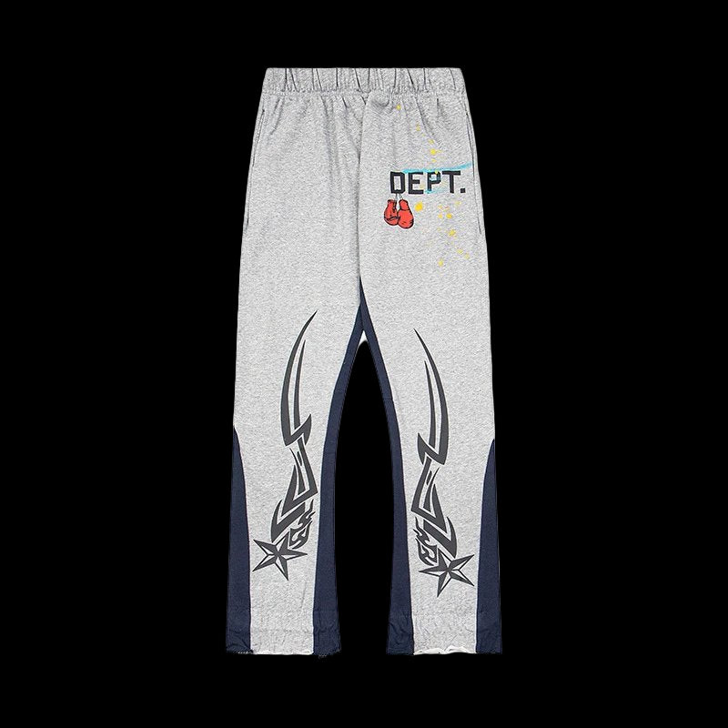 Gray sweatpants featuring a colorful paint splash print and a vintage-inspired faded wash.