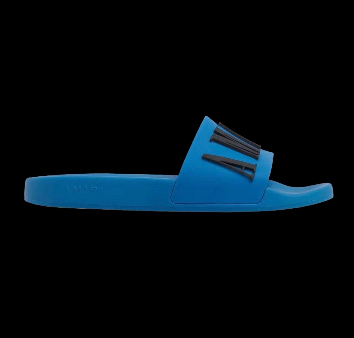 Black Amiri pool slides with a smooth finish and cushioned footbed for comfort.