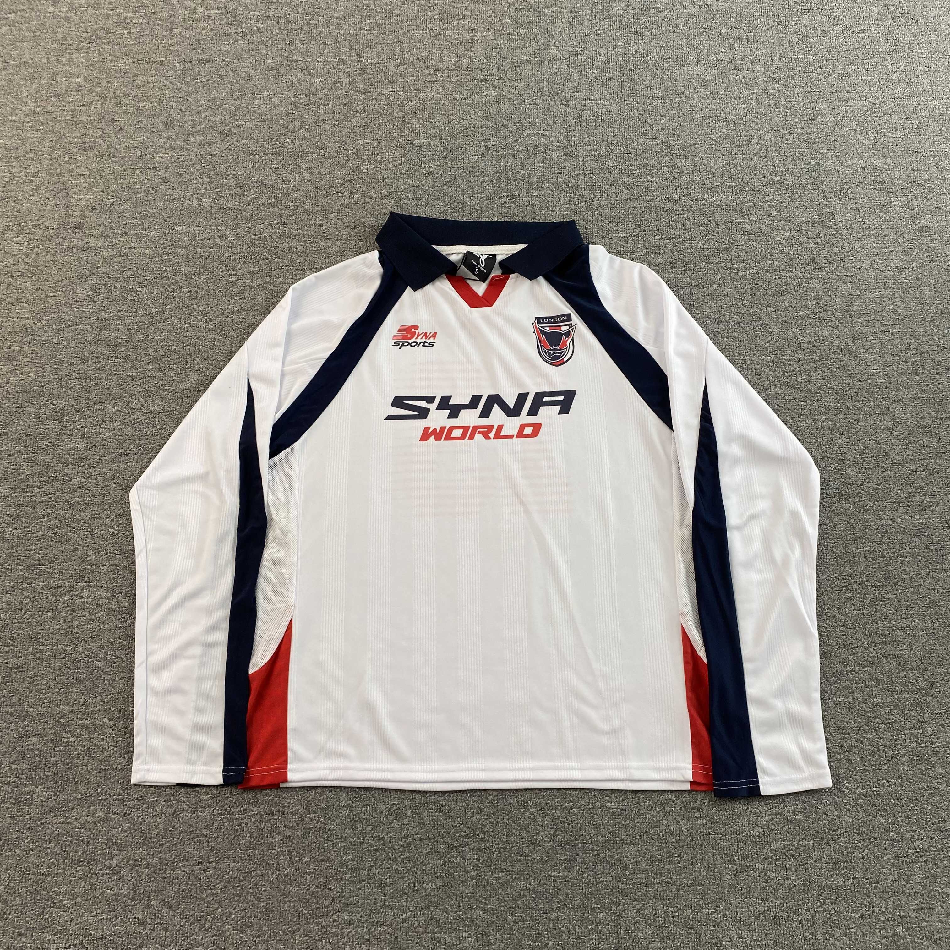 SYNA WORLD DVL FOOTY V2 T SHIRT - PASTFRWRD
