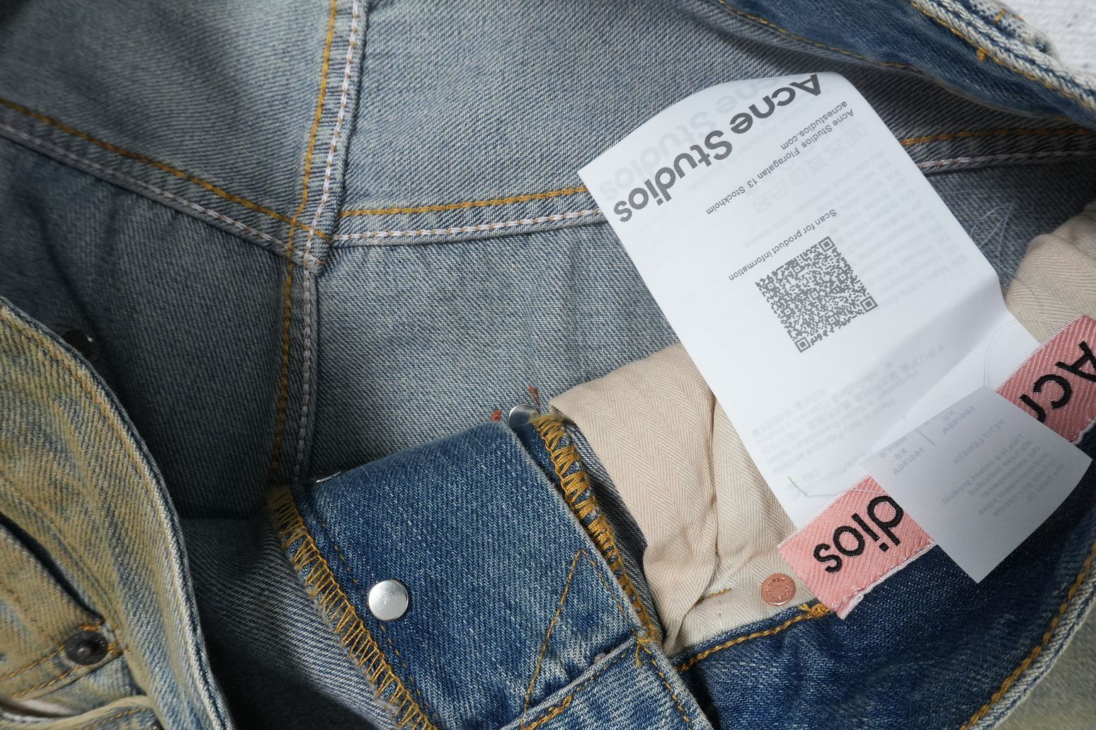 Acne Studios mud-dyed distressed wide-leg baggy jeans with tags.