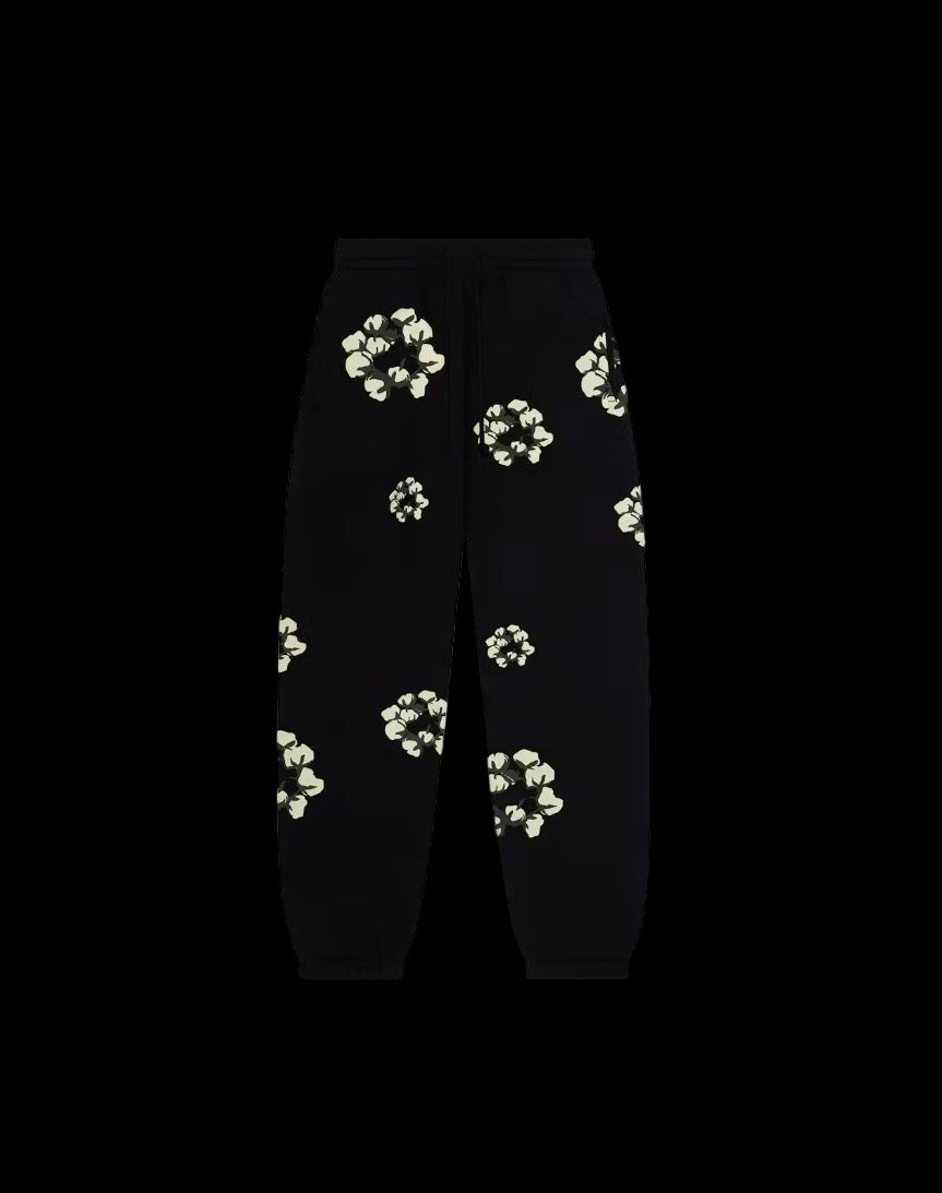 Faded wash sweatpants with a cactus wreath design and ribbed cuffs for comfort and style.