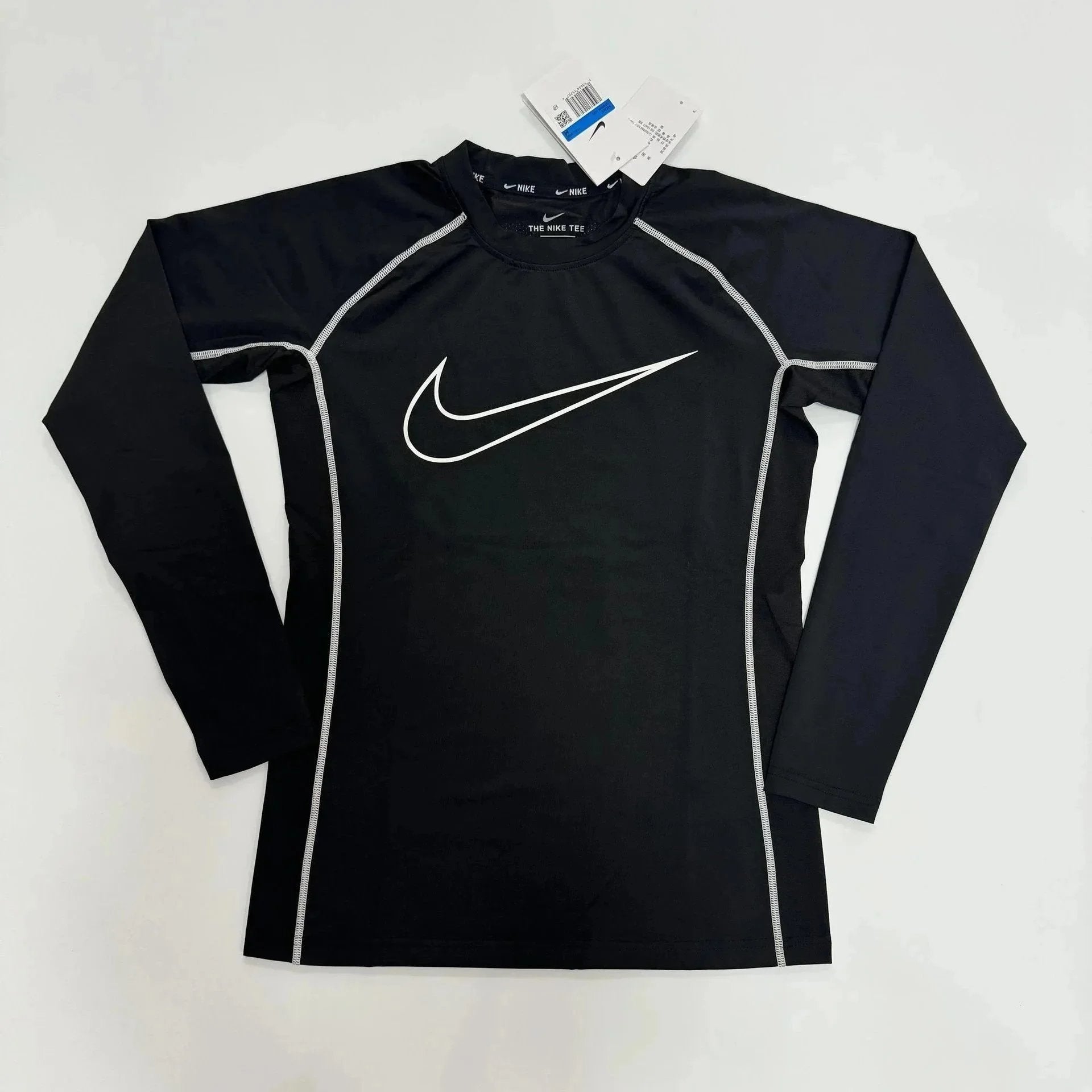 Longsleeve black compression top with Nike logo and breathable fabric for enhanced performance.