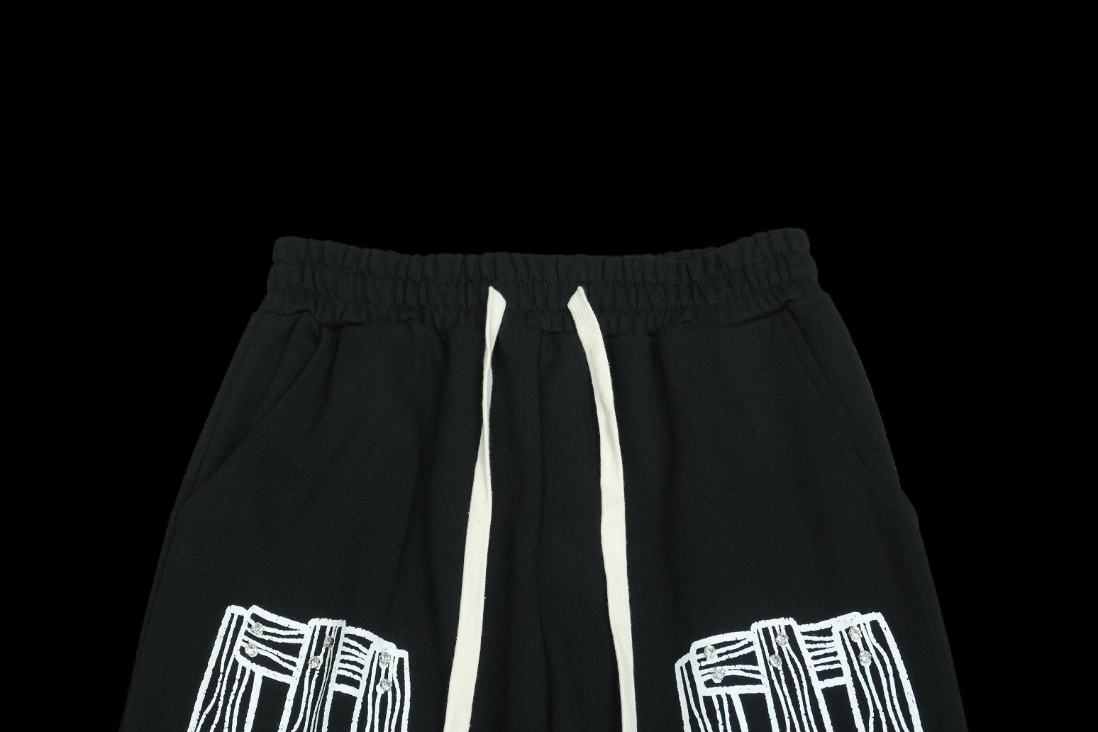 Black sweatpants with white drawstring and graphic print.