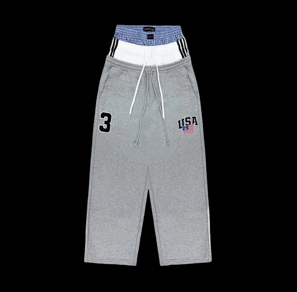 Triple layered sweatpants in heavyweight cotton with a faded wash and unique graphic design.