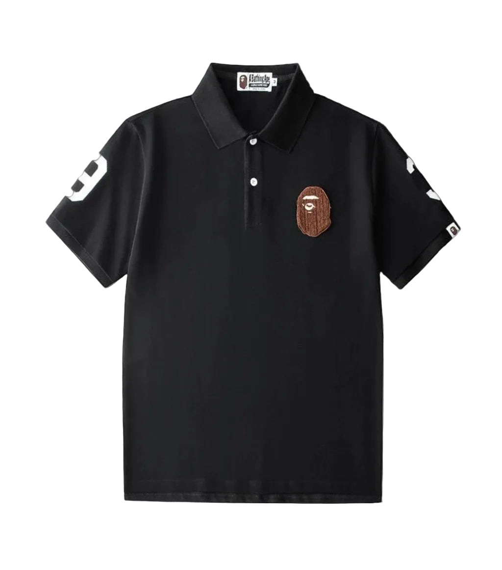 Bape polo shirt with ribbed crewneck, short sleeves, and vintage-inspired faded wash.