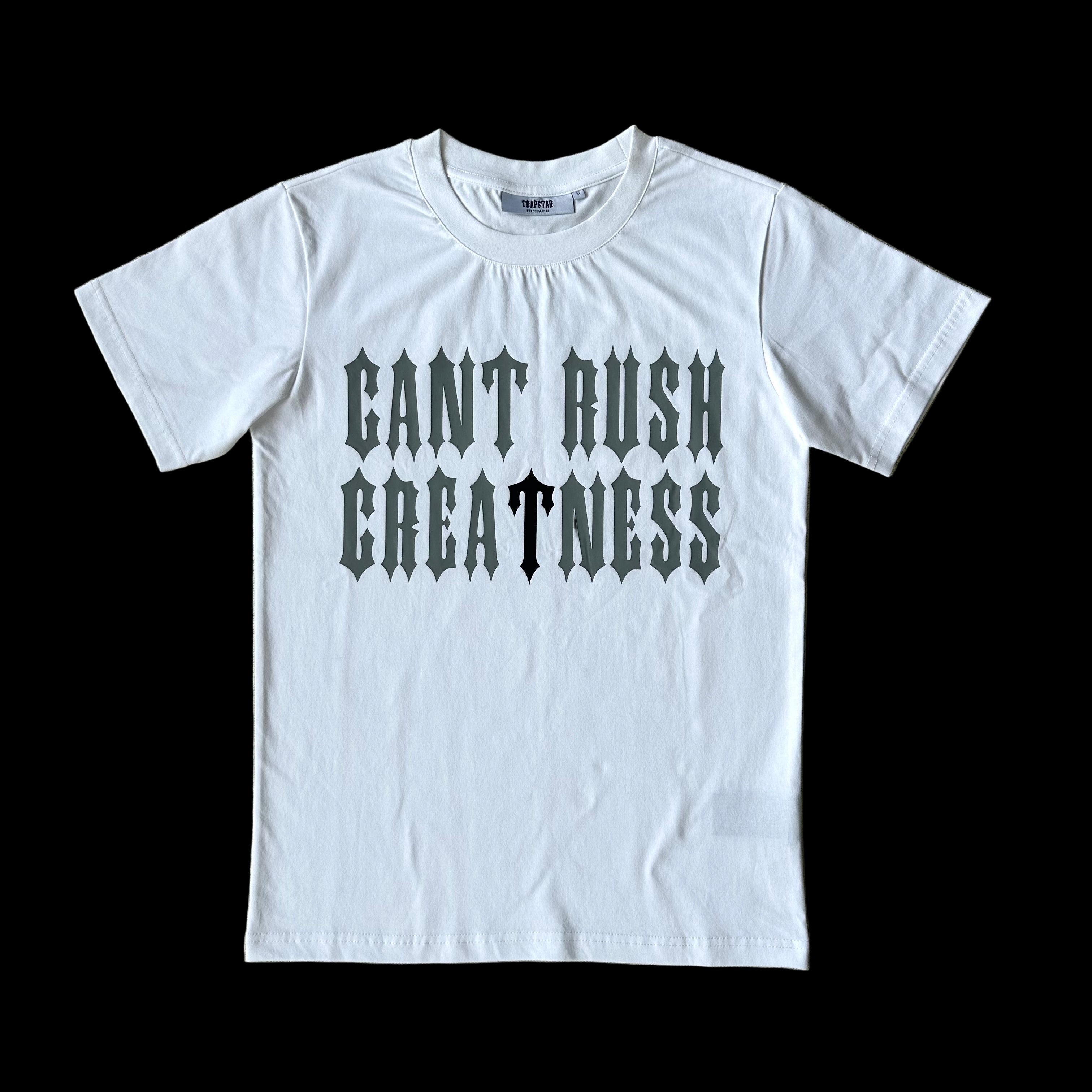 Syna X Trapstar white t-shirt with "Cant Rush Greatness" graphic.