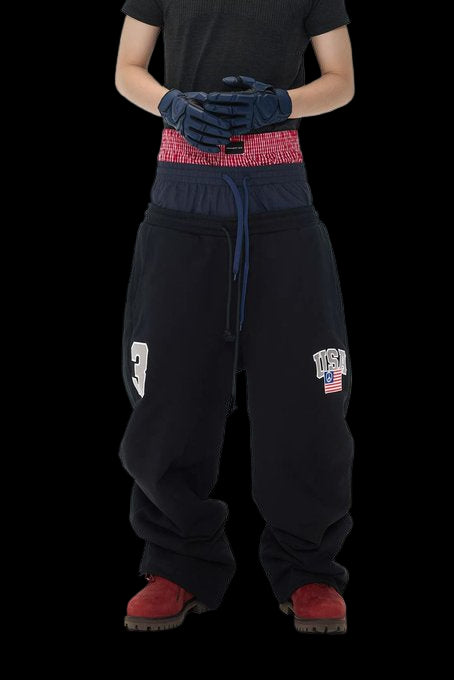 Project GR sweatpants with triple layers, faded wash, and Rhude Roadway Racing graphics.