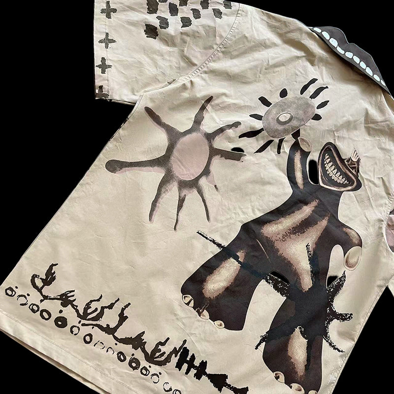 Travis Scott Painter's button-up shirt in faded wash with ribbed crewneck and racing graphics.